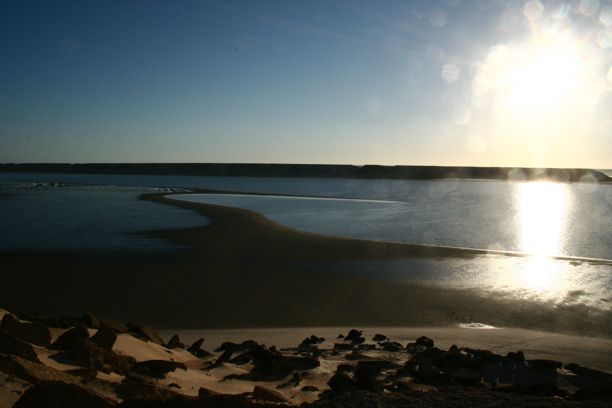 Sunlight on the still water of the Dakhla lagoon