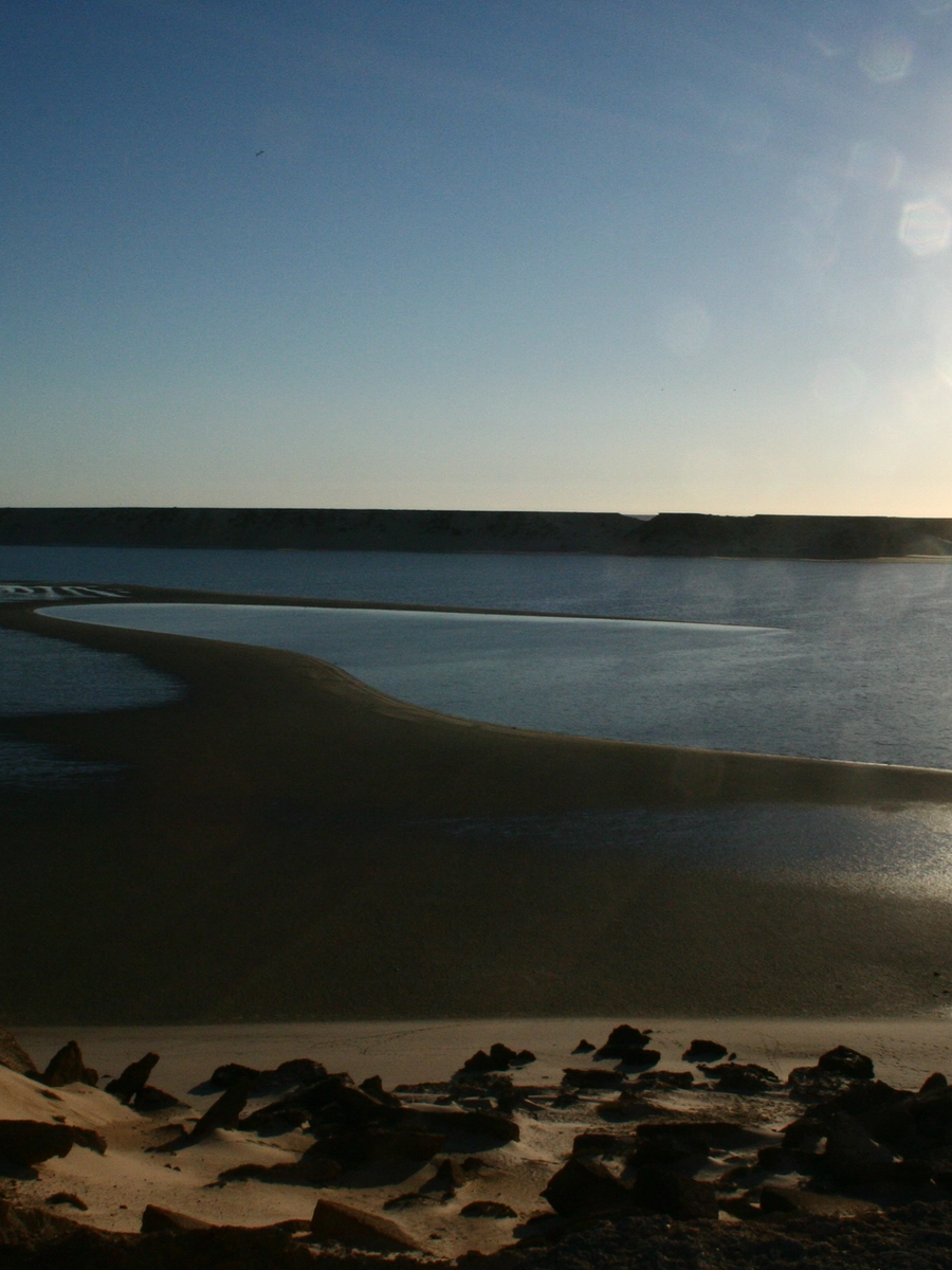 Sunlight on the still water of the Dakhla lagoon