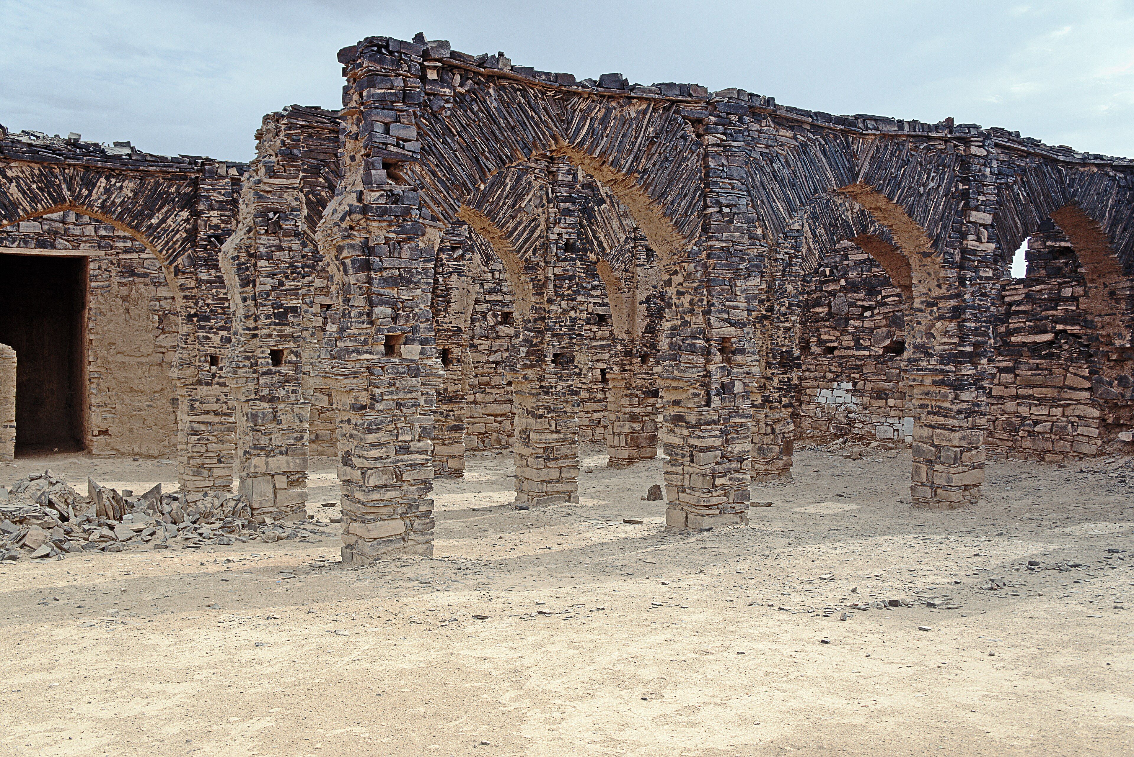 Stone arches of the ruined zawiya of Ma al-Aynayn in Smara