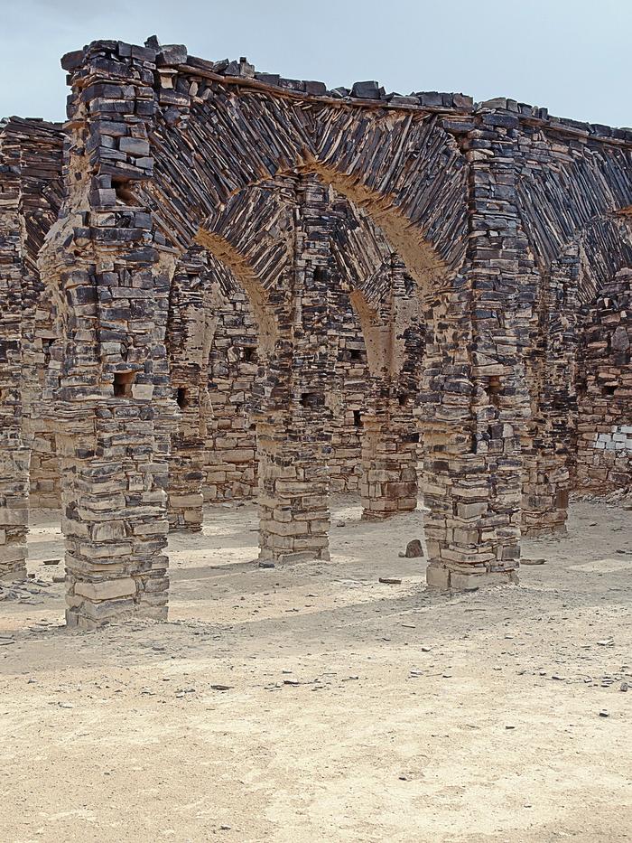 Stone arches of the ruined zawiya of Ma al-Aynayn in Smara