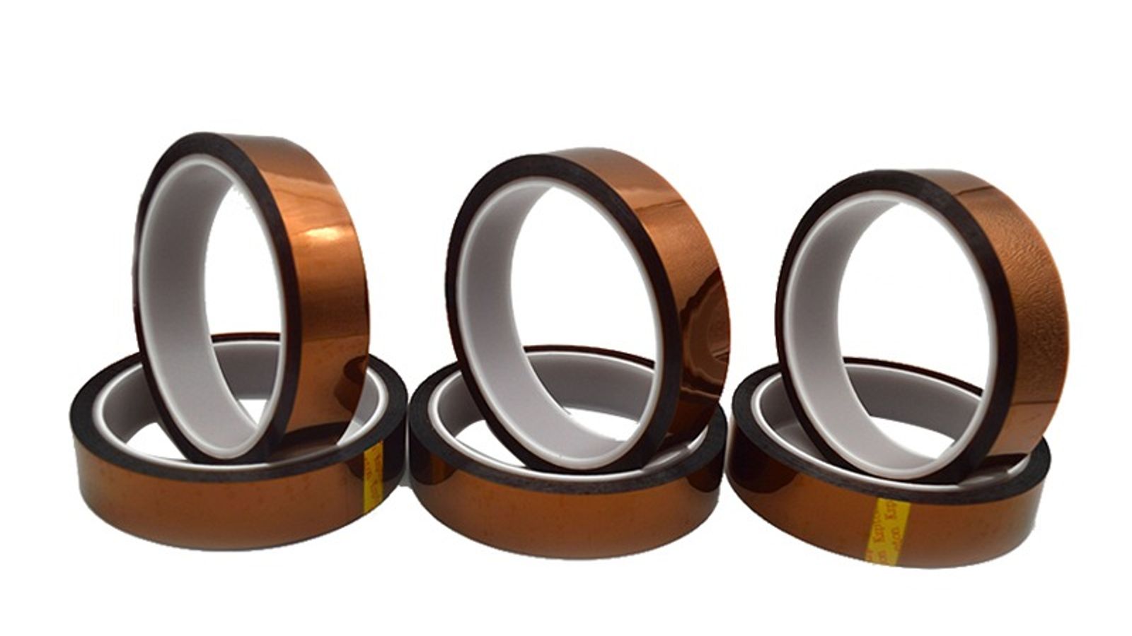 Flat-rolled high-temperature masking tapes in polyimide amber, PET blue, crepe tan and fiberglass white beside a thermal oven
