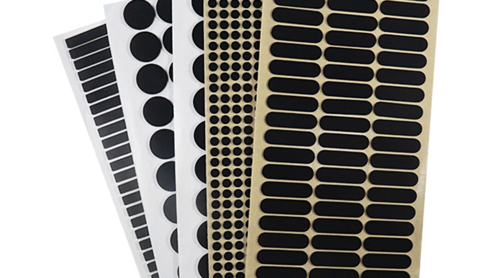 Custom powder coating masking kit containing high-temperature silicone plugs, caps, die-cut shapes, and snap hooks arranged around an aluminum part