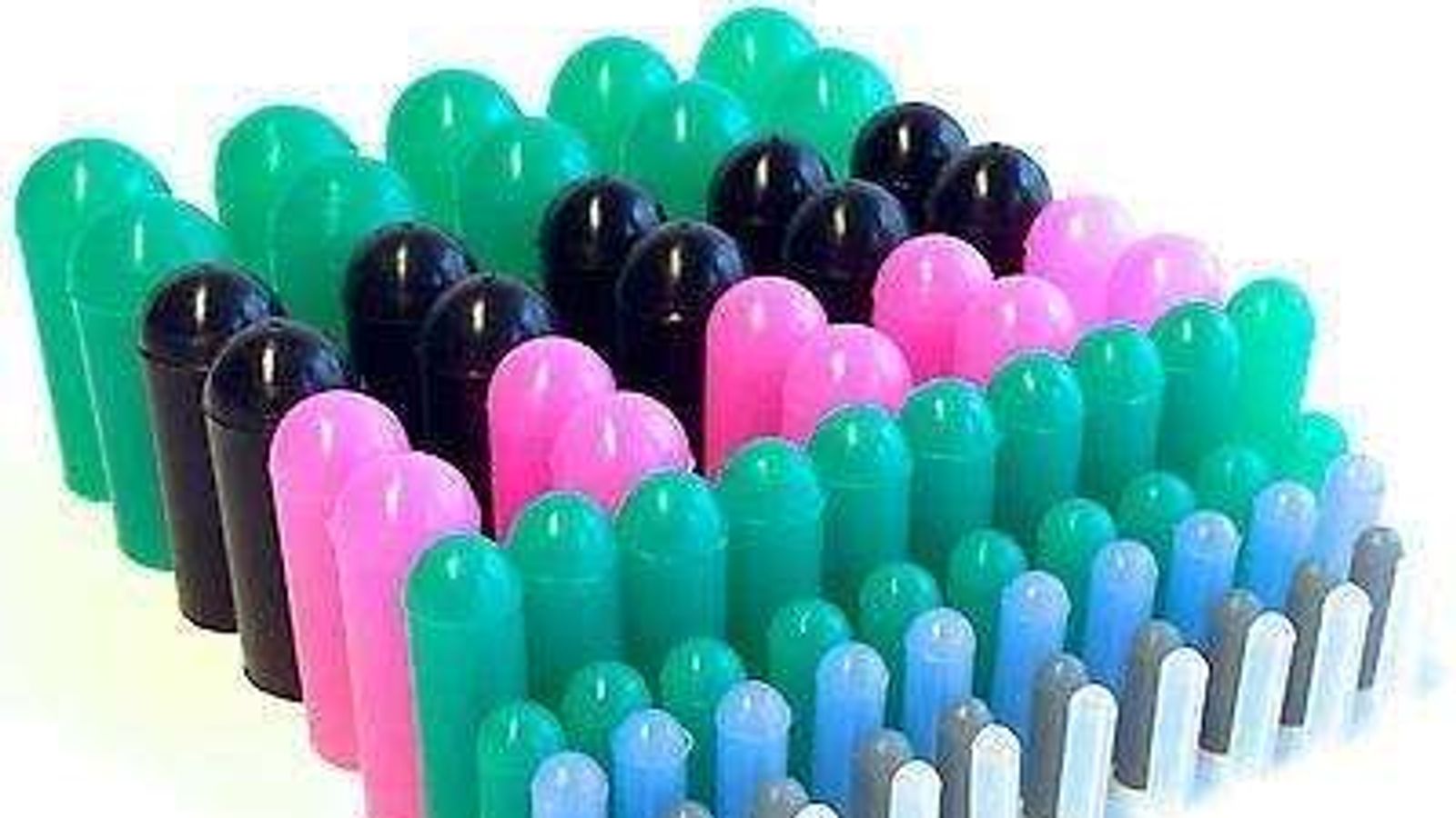 High-temperature silicone masking caps in assorted sizes shielding threaded studs, holes and ports on metal parts during powder coating and anodizing