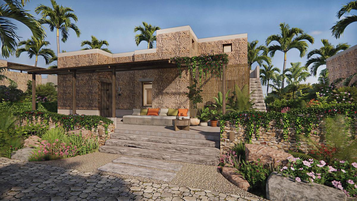 Stone-built Zanzibar villa exterior with veranda, landscaped garden and tropical palms