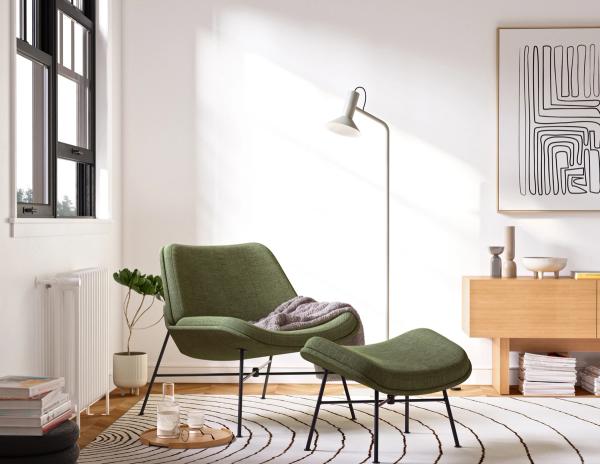 Green chair and ottoman in a living room