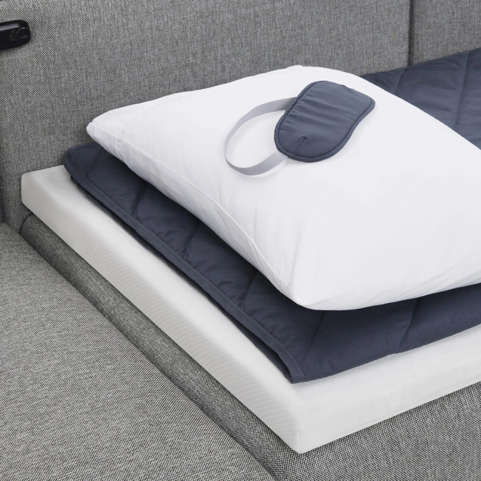sleep kit folded on range sofa