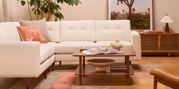 ivory nomad sectional with serif coffee table