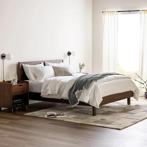 Wood bed frame with a wooden nightstand