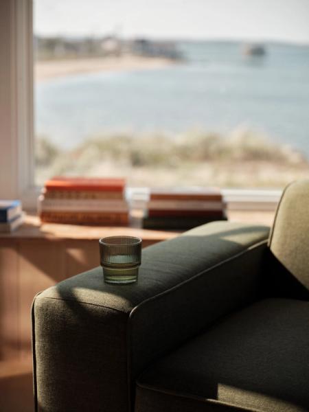 Glass sitting on chair arm