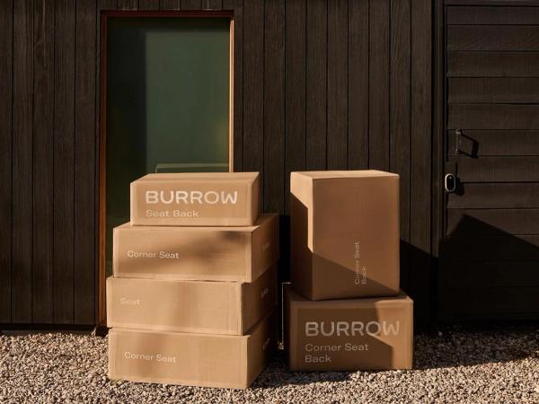 Burrow boxes stacked on front door