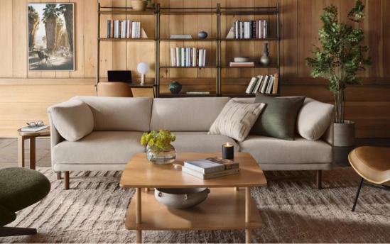 range 3 seat sofa in georgia clay set in a living room with a coffee table and bookshelf