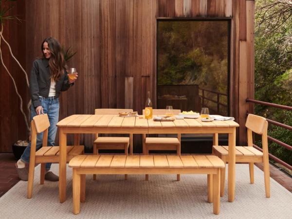 teak outdoor dining table on patio