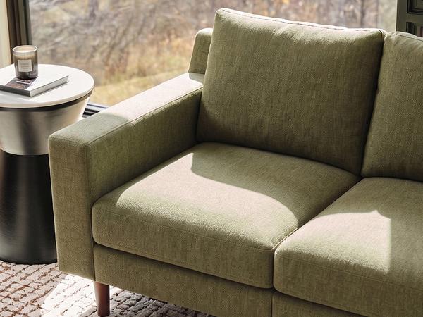 sunny corner of a mercer sofa in olive