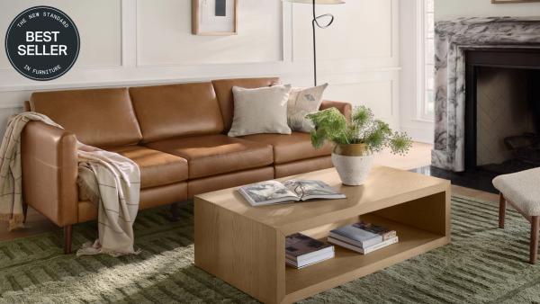 Best Seller: Nomad Sofa in Camel Leather in a living room setting