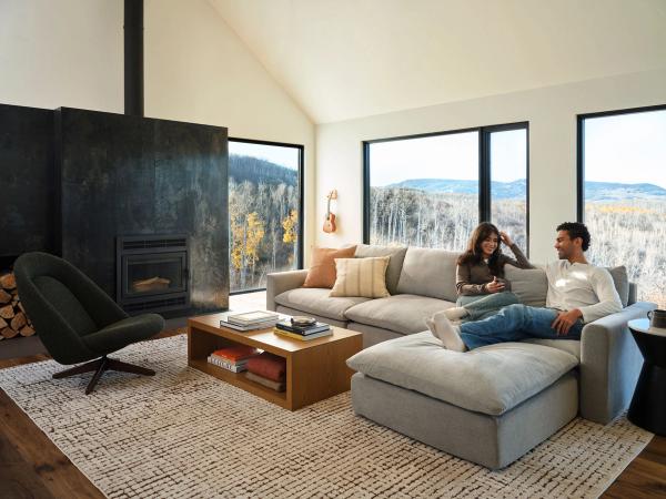 couple sitting on gray russet chaise sectional