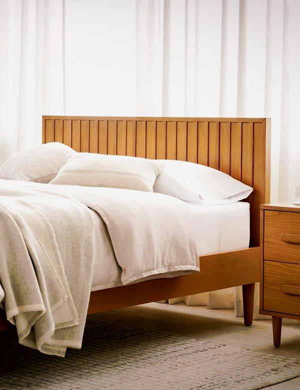 Chorus bed in oak with a matching nightstand