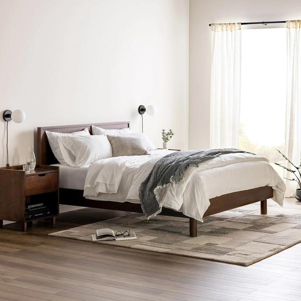 Wood bed frame with a wooden nightstand