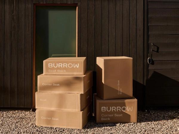 Burrow boxes stacked on front door
