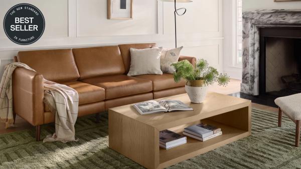 Best Seller: Nomad Sofa in Camel Leather in a living room setting