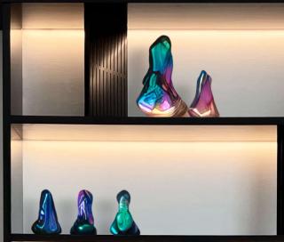 Multi-colored sculptures on shelves