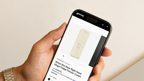Smeg product page on mobile showing the 60cm 50s Style fridge freezer in cream, with pricing and instalment options, built by UNRVLD.