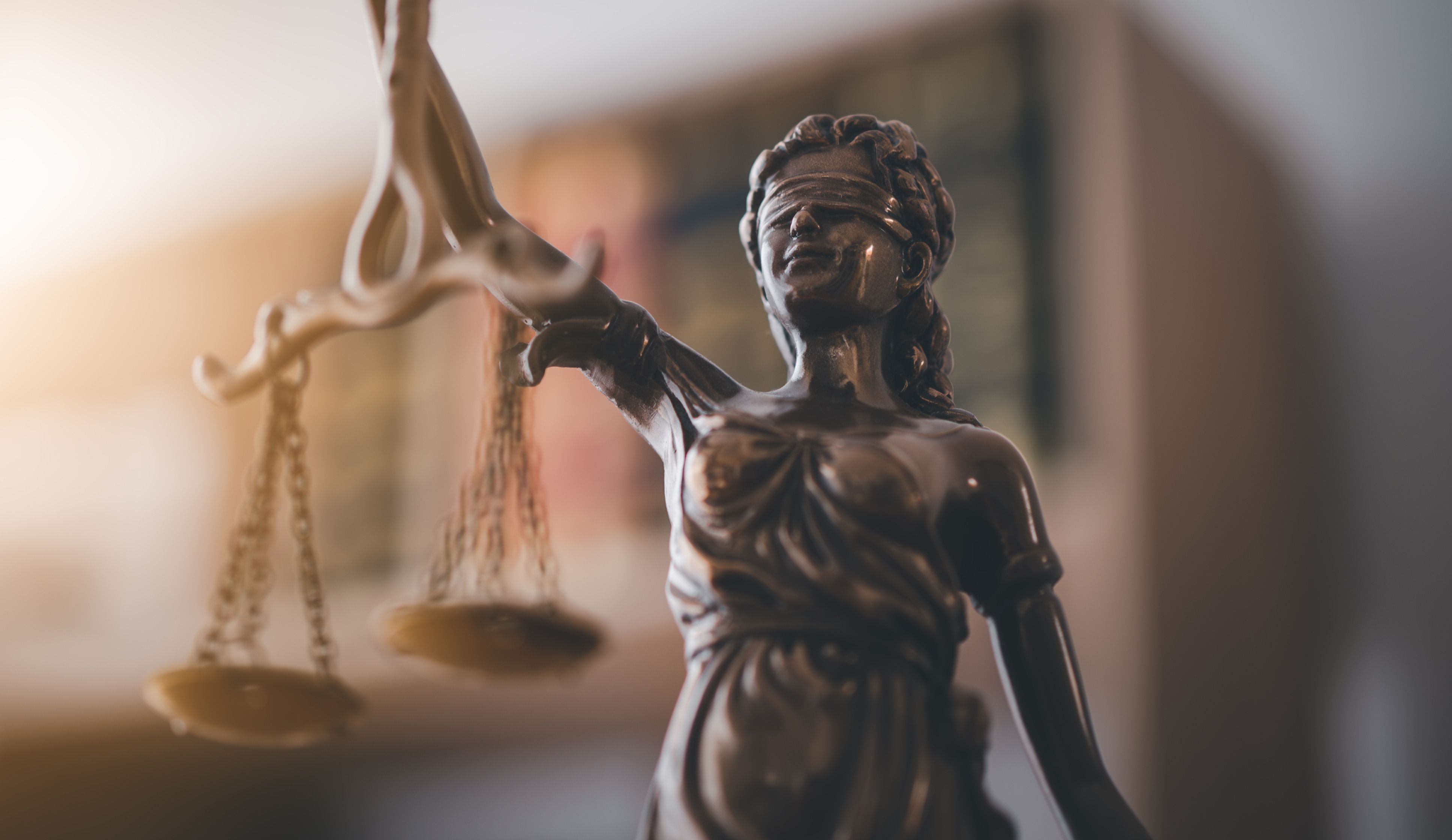 Statue of Lady Justice holding a set of scales