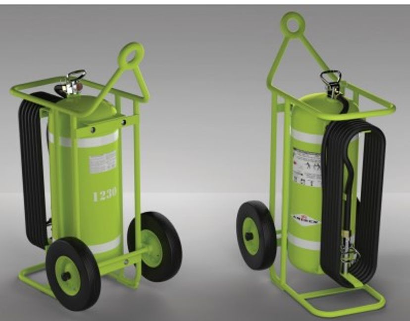 Two green wheeled fire extinguishers with black hoses and metal frames are shown, each positioned at a slightly different angle on a gray background.