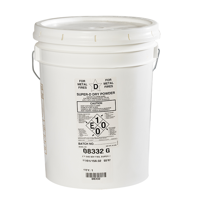 A white 5-gallon bucket labeled “Super D Dry Powder” for metal fires, with safety warnings, hazard symbols, and handling instructions printed on the front.