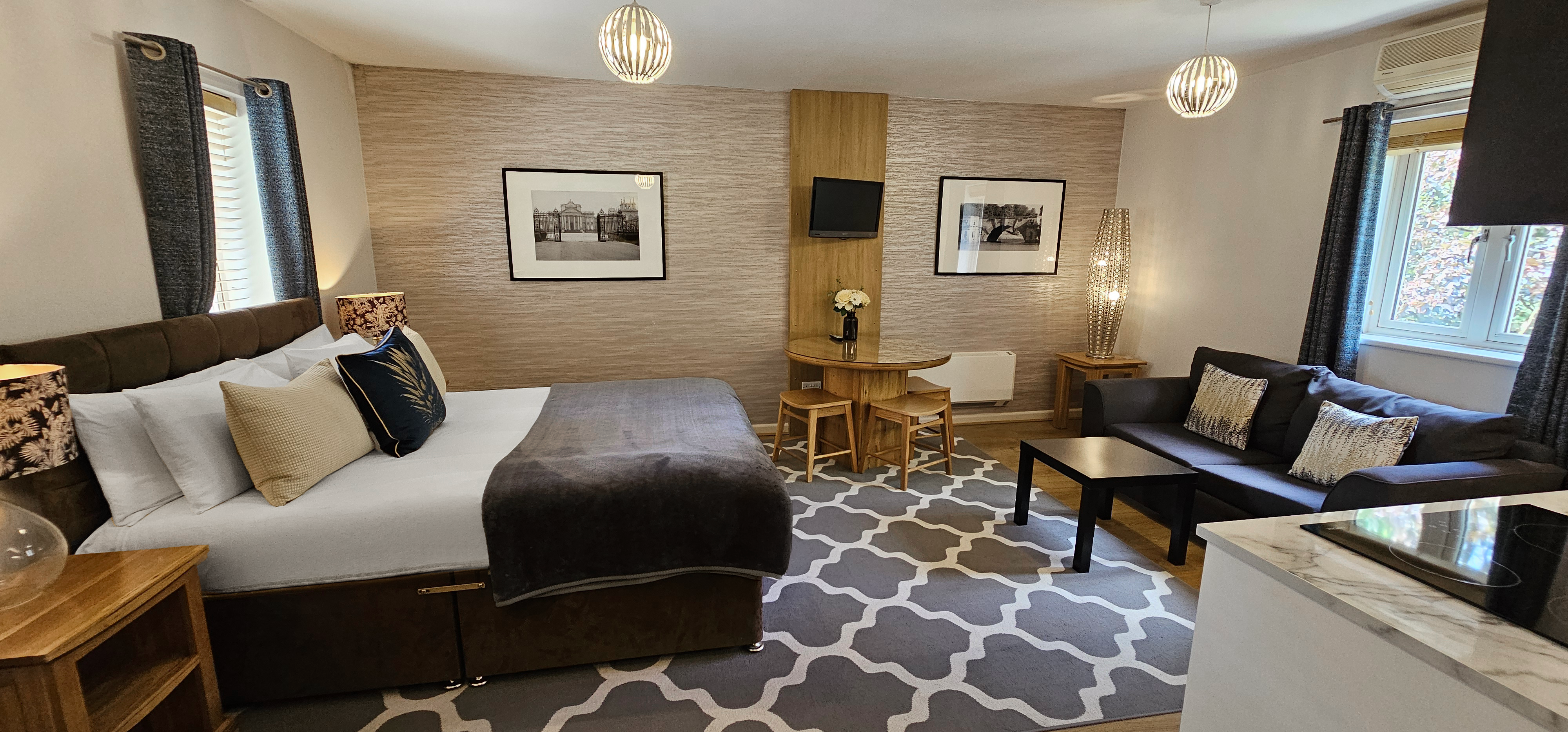Studio Suite with dining table & chairs, sofa, coffee table & kitchenette