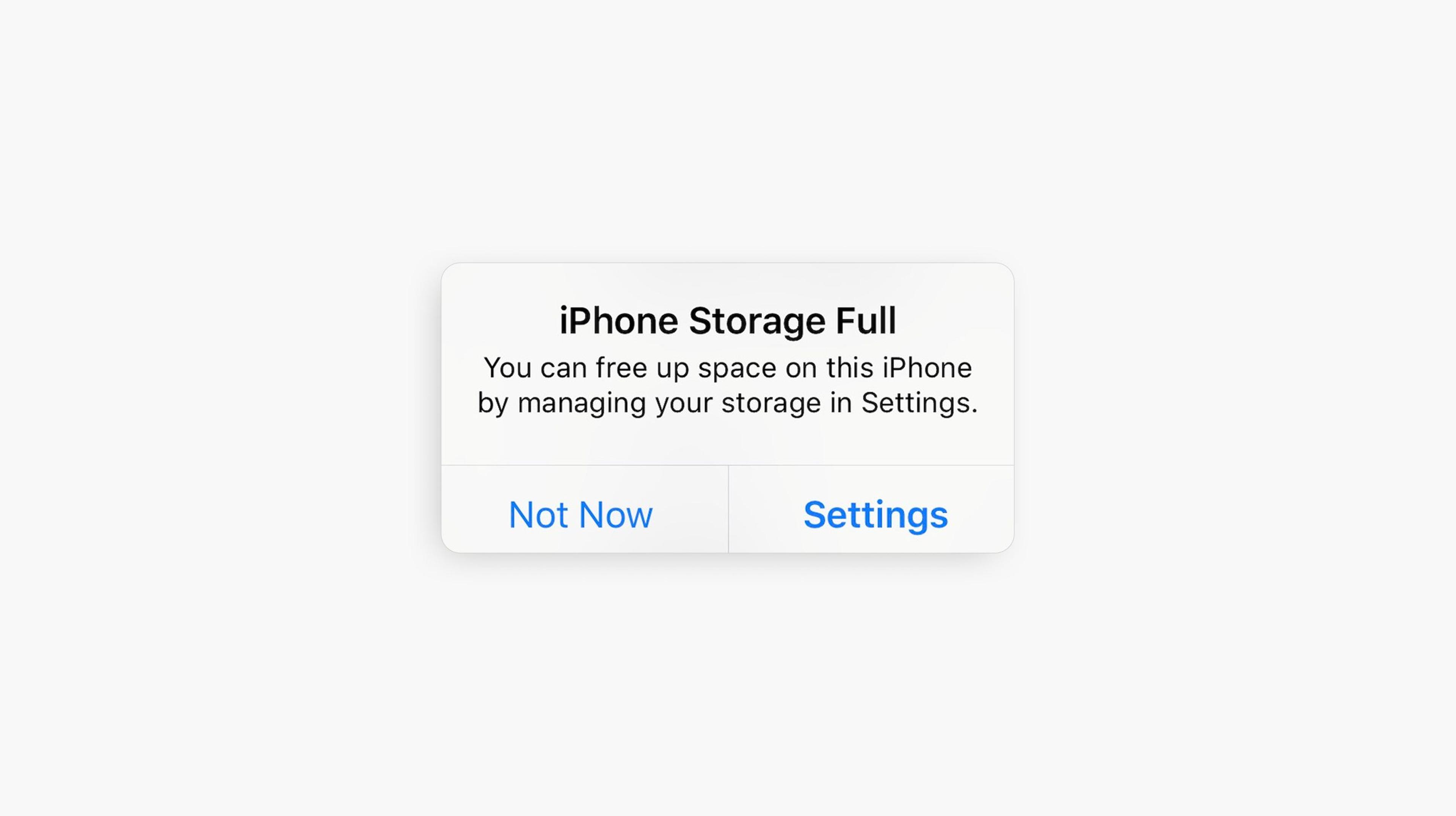 Screenshot of an iOS 'iPhone Storage Full' alert with Not Now and Settings options