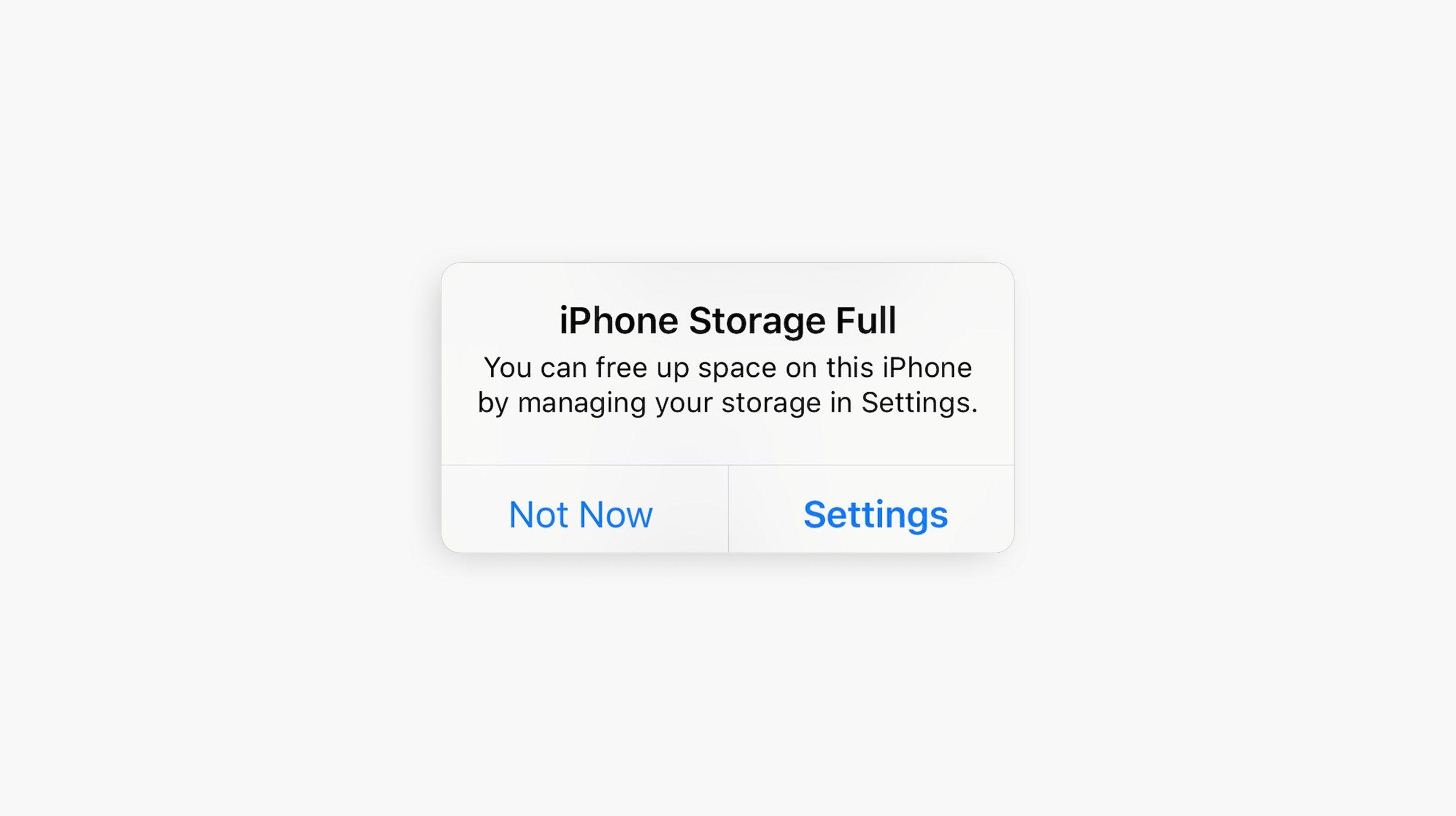 Screenshot of an iOS 'iPhone Storage Full' alert with Not Now and Settings options