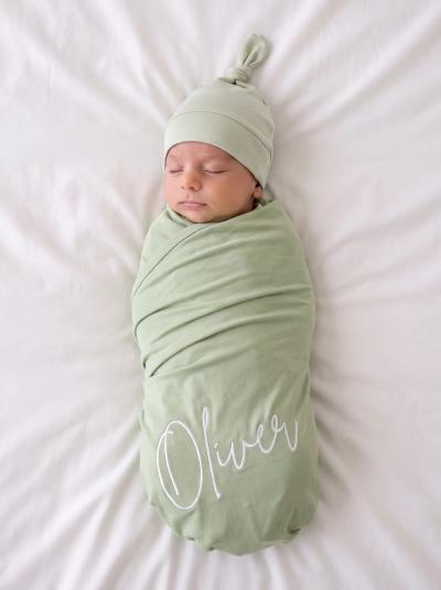 Baby wrapped in a soft swaddle blanket