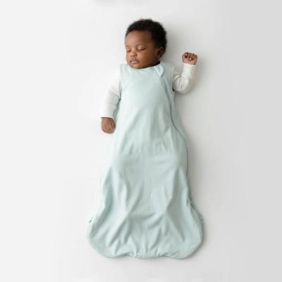 Baby wearing a 0.5 TOG bamboo sleep sack
