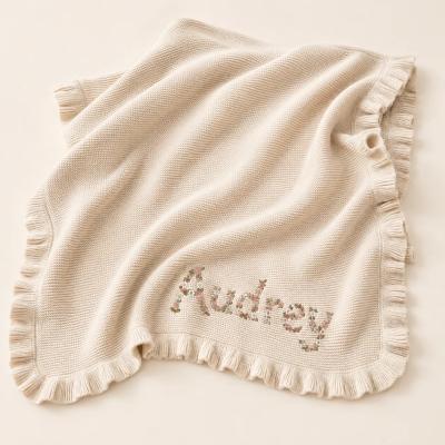 Personalized cotton knit baby blanket with embroidered name