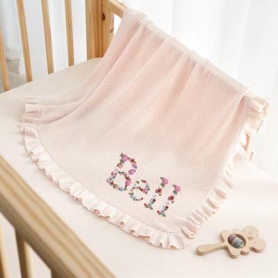 Soft cream baby blanket with textured finish