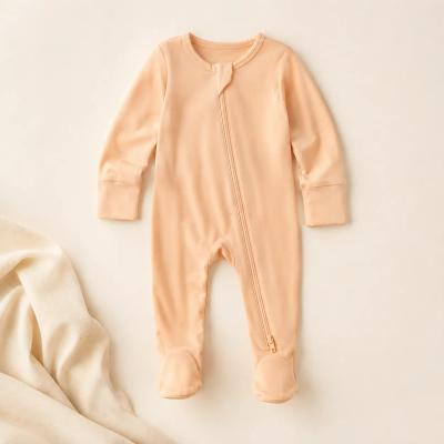 Soft bamboo zip baby pajamas laid flat