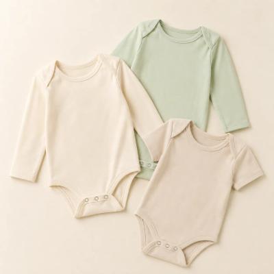 Soft baby bodysuits with solid and embroidered designs