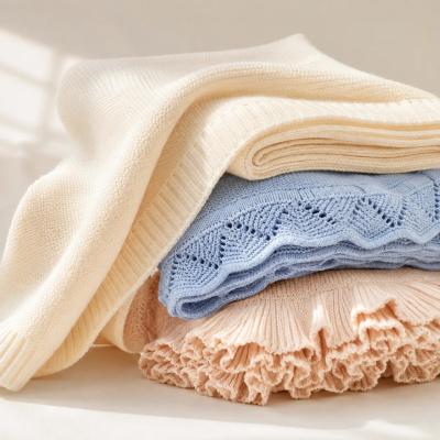 Folded cotton knit baby blankets with cable texture
