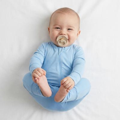 Baby wearing one-piece footie sleepwear