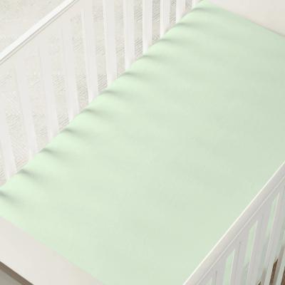 Bamboo crib sheet fitted on a nursery mattress