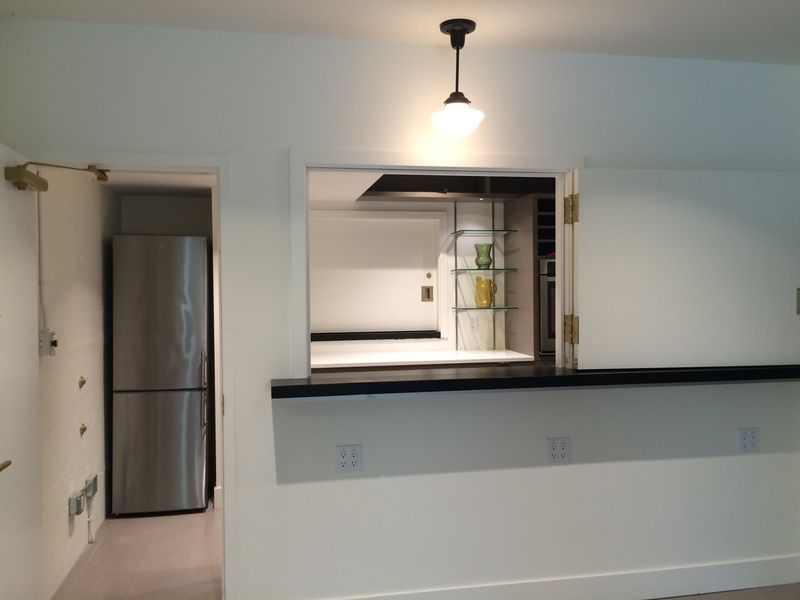 The servery with its refrigerator and the serving hatch beyond