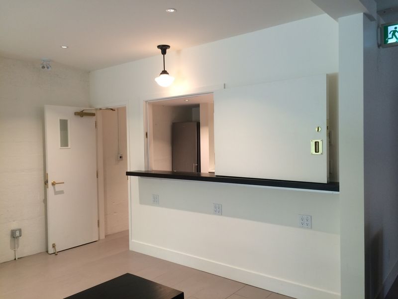 The servery hatch open onto the lobby