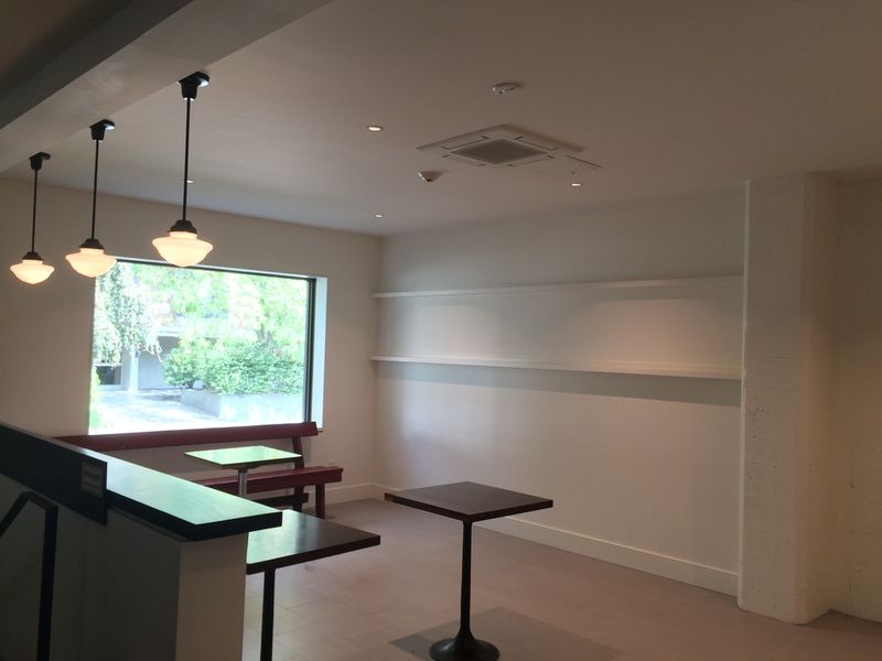 The lobby seating area, with a high counter under the street window