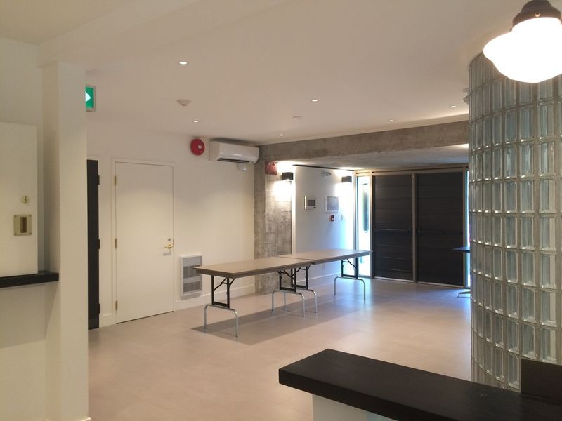 The lobby looking towards the entrance, a folding table along the counter