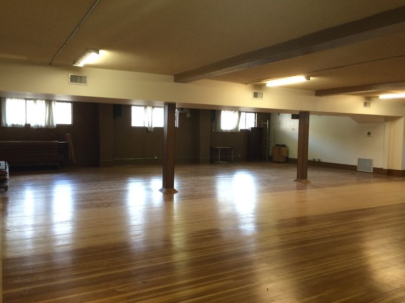 The Downstairs Hall from the far corner, windows along one wall