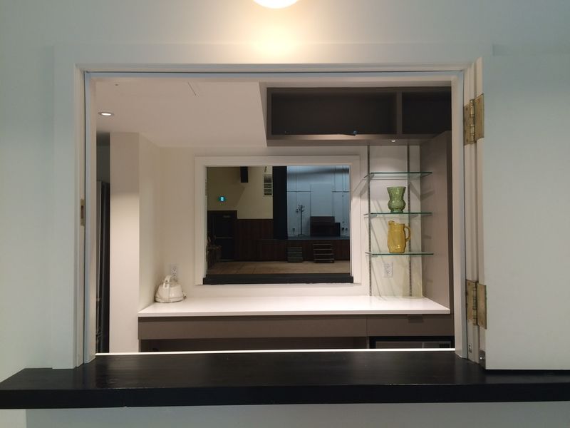 The servery seen from the lobby, its shutters folded open