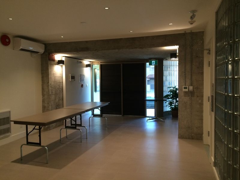 The main lobby, with a folding table set out beside the glass doors