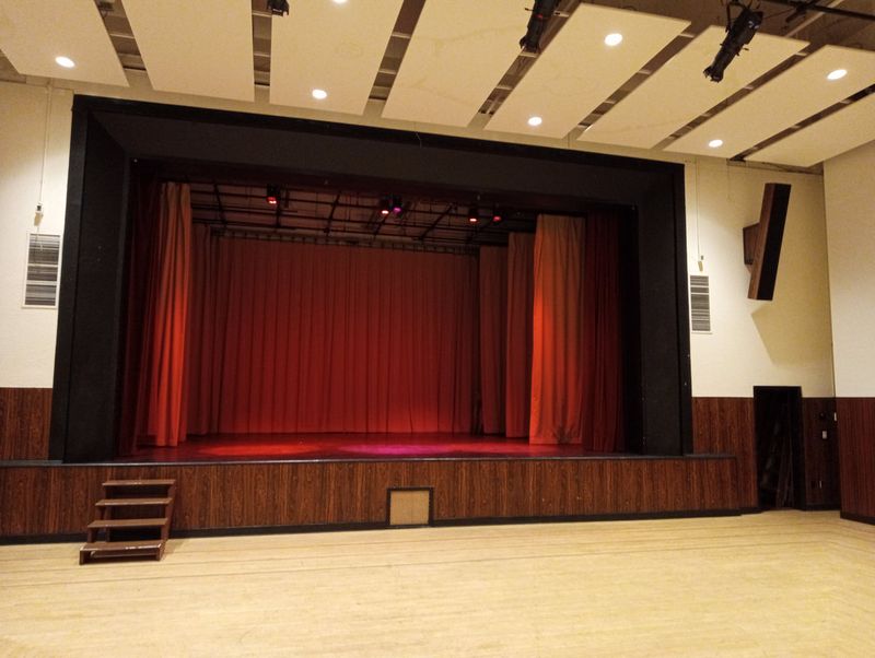 The Upstairs Hall stage with the red house curtain closed