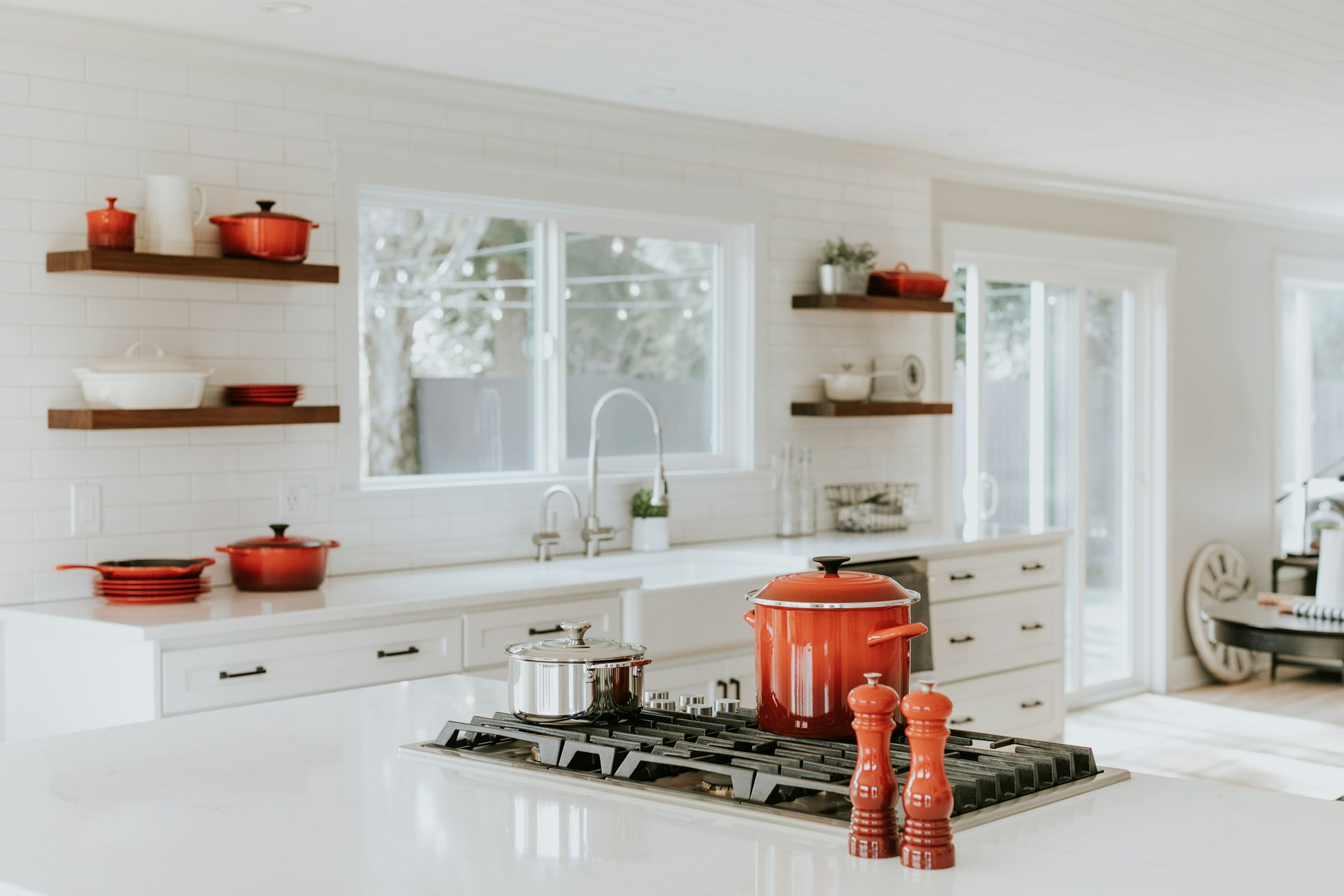 A private chef plating dinner in a residence kitchen
