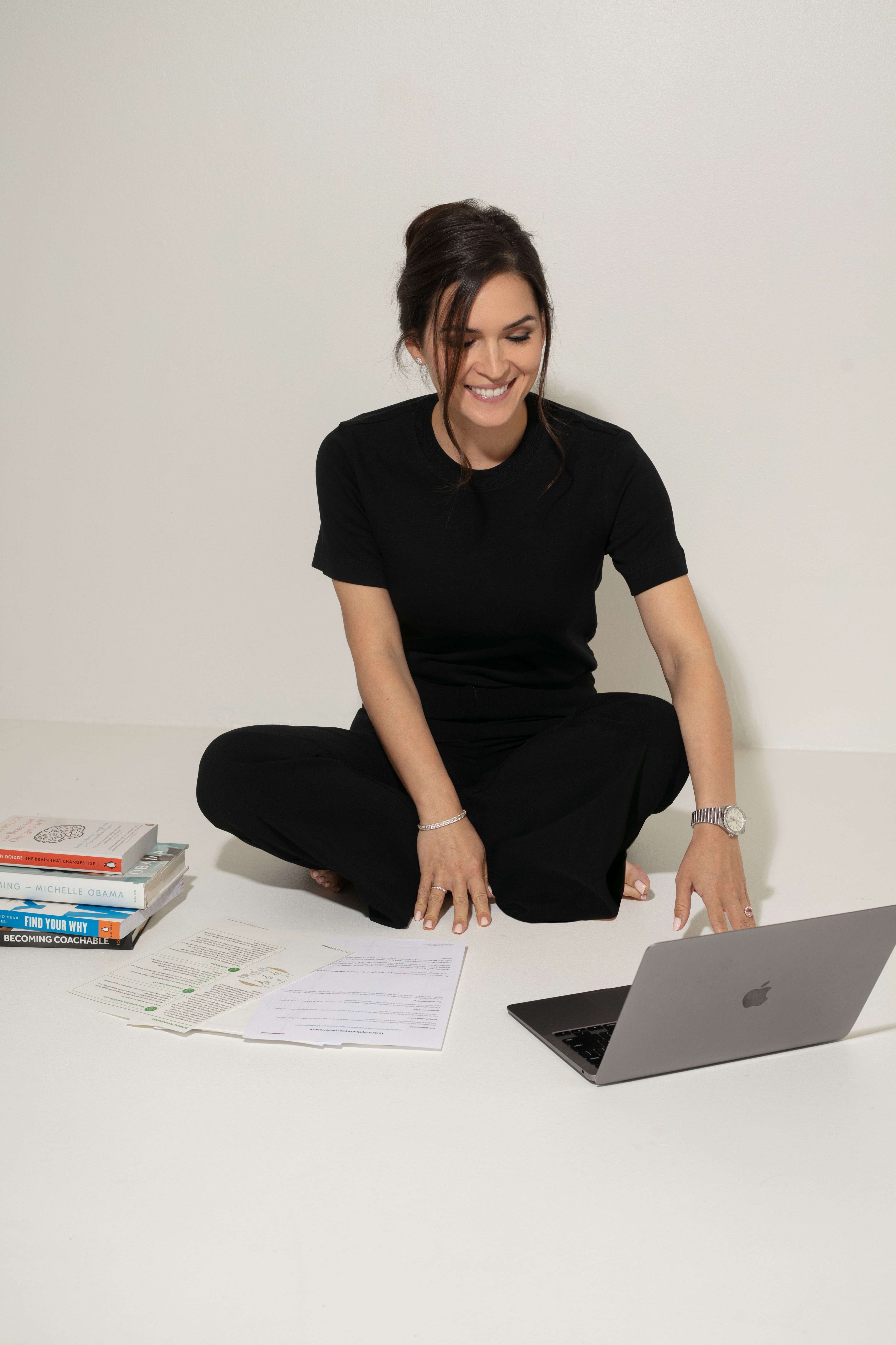 Photo of Adela Warkentin seated at computer